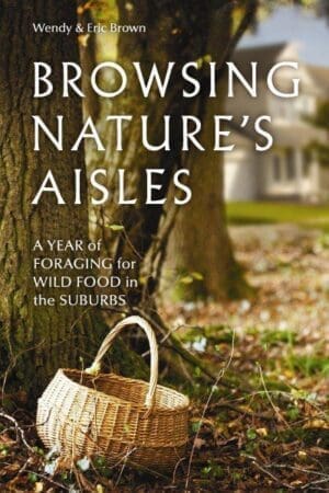 A woven basket by a tree; house behind; Browsing Nature's Aisles in the wild.