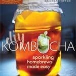 A jar of kombucha with a cloth lid on the "DIY Kombucha" book cover.