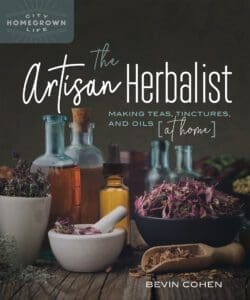 Glass bottles and dried herbs hint at natural healing from The Artisan Herbalist.