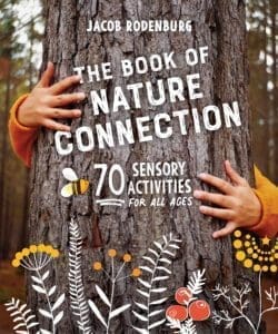 Hugging a tree; "The Book of Nature Connection" sparks nature activities and creativity.