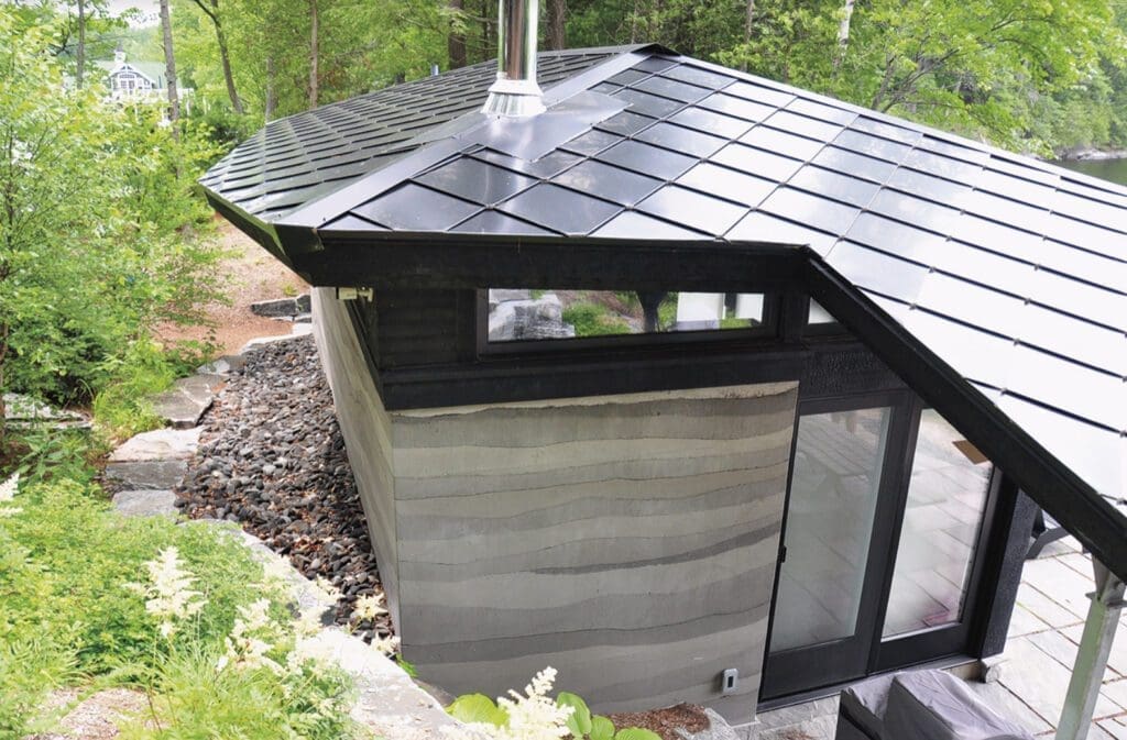 The "Exterior" product features a small modern building with a distinctive angular black roof, expansive windows, and a natural stone pathway, all nestled within a wooded area.