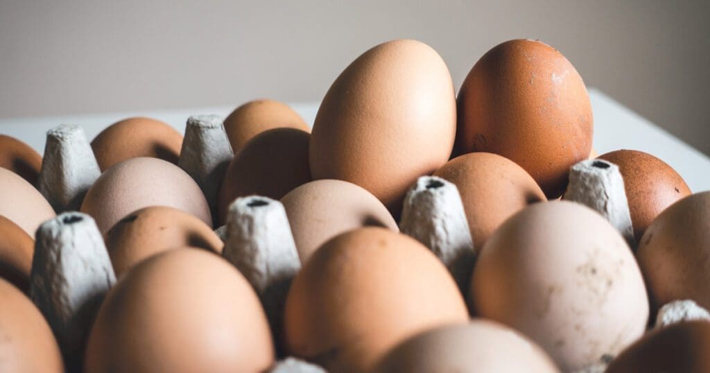 A carton of brown eggs.