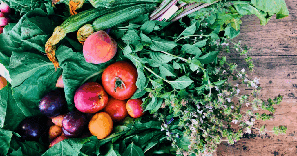 Assorted fresh fruits and vegetables for year-round food and easy food storage on a table.