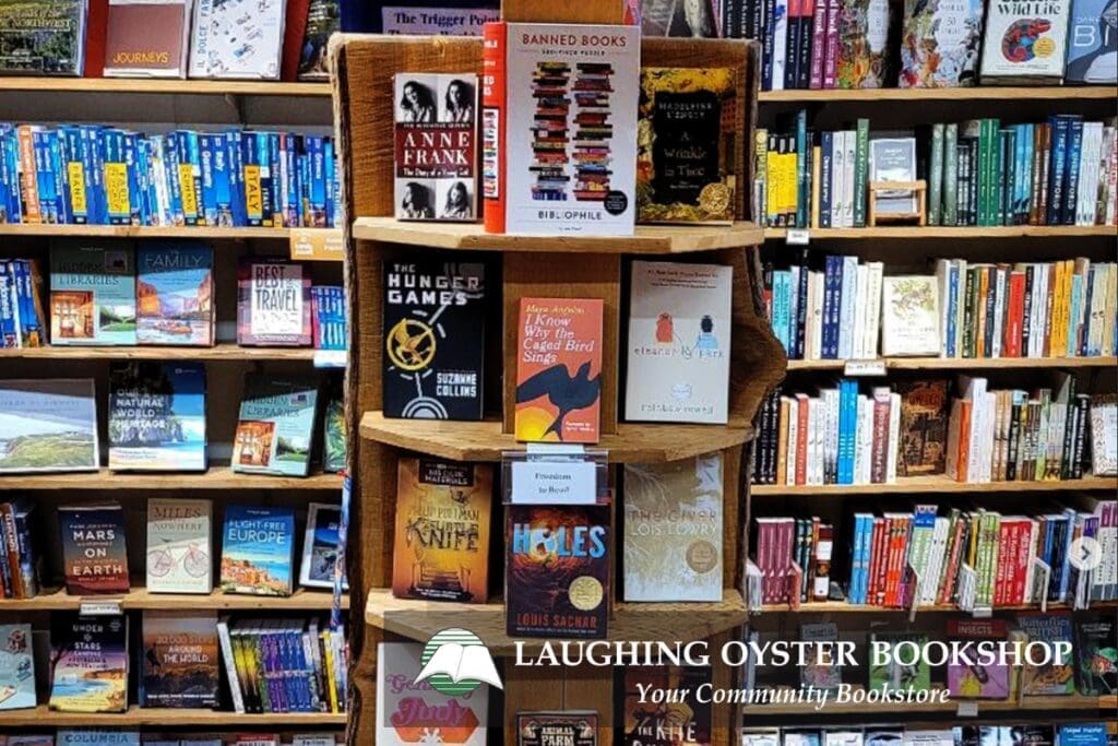 Bookshelves of colorful reads; a “Banned Books” display at Courtenay’s Laughing Oyster Bookshop.