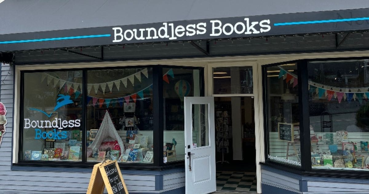 Shopfront of Boundless Books, an independent bookstore with large windows and colorful decor inside.