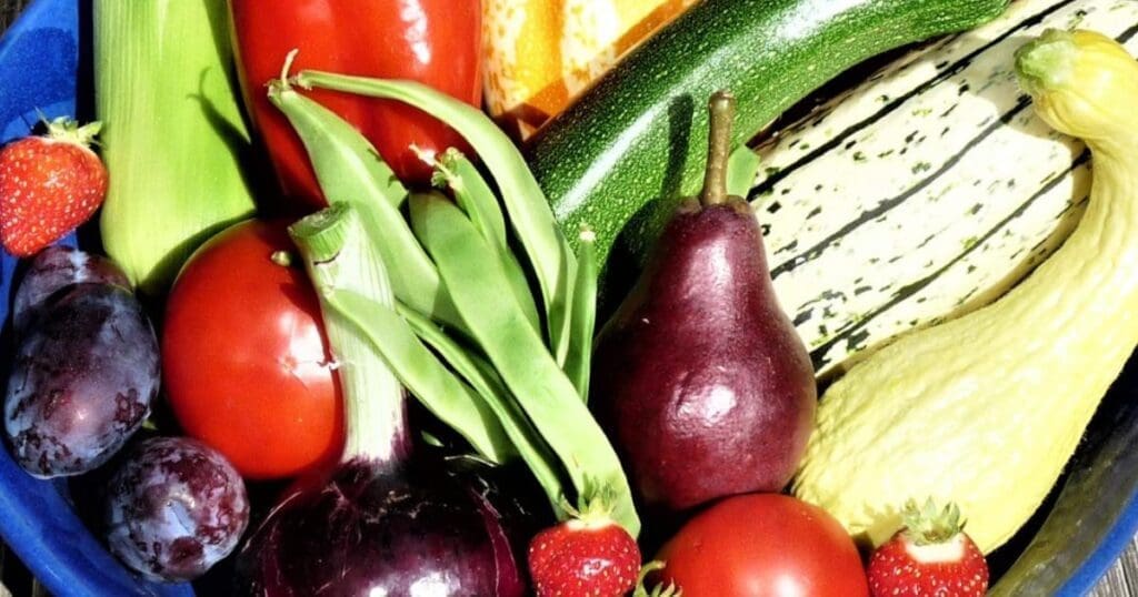 Assorted fresh fruits and vegetables, perfect for Pacific Northwest gardening enthusiasts.